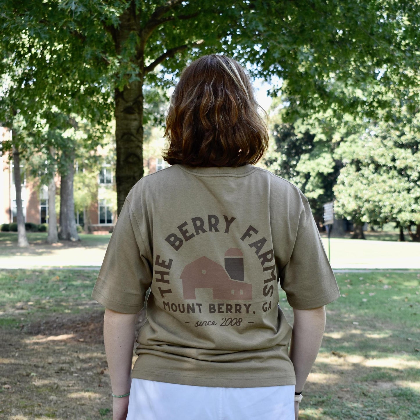 Back of shirt says "The Berry farms" with farm logo